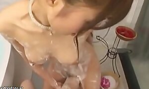 Japanese sensual babe gives soapy massage