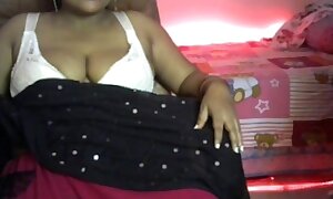 Desi sexy spread out shakes her boobs and does erotic dance with her go steady with and applies a nipple clamp on the boy's cock.
